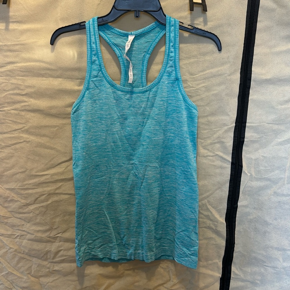 Light blue lululomon razorback tank. Size 8. In great condition.